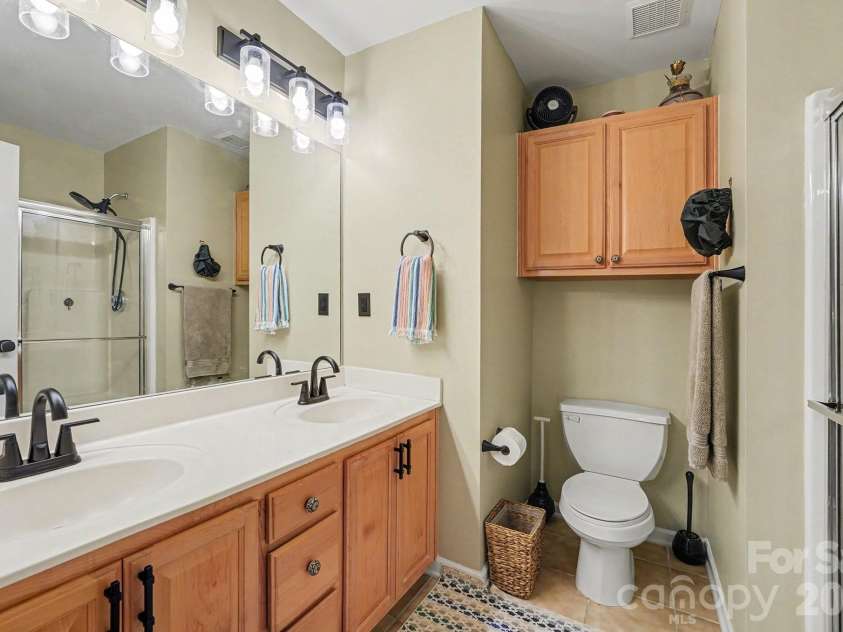 8331 Christmas Court, Charlotte, NC 28216.  MLS# CAR4340042, YatesRealty ID 2344. Primary full bathroom with tile floors,