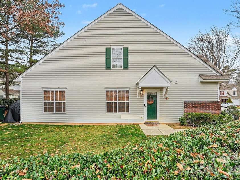 8331 Christmas Court, Charlotte, NC 28216.  MLS# CAR4340042, YatesRealty ID 2344. Side of townhome with side patio and sidewalk..