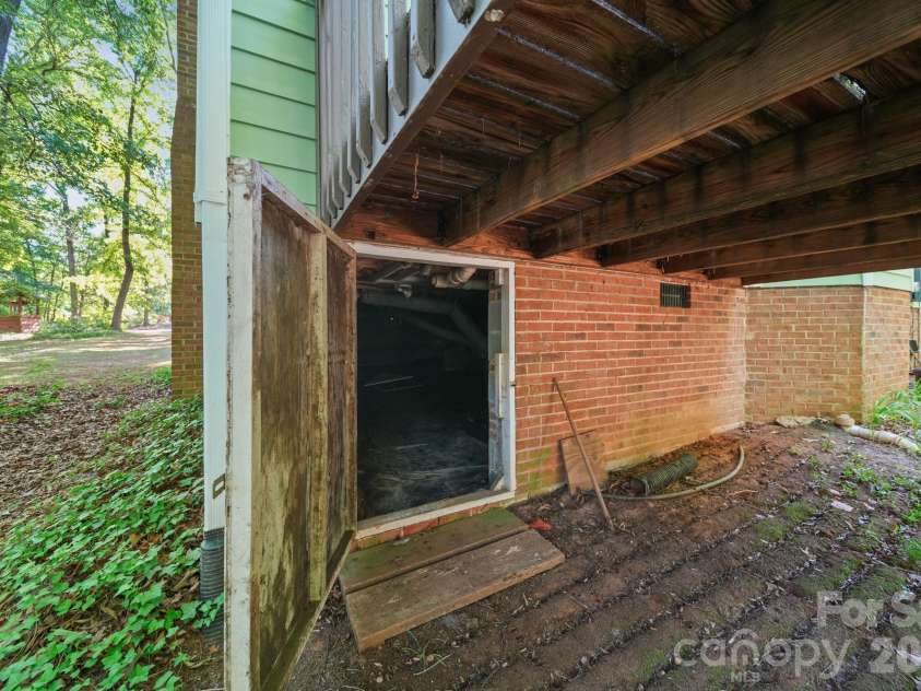 11421 Winners Circle, Charlotte, NC 28215.  MLS# CAR4344294, YatesRealty ID 23444. Crawl Space entrance