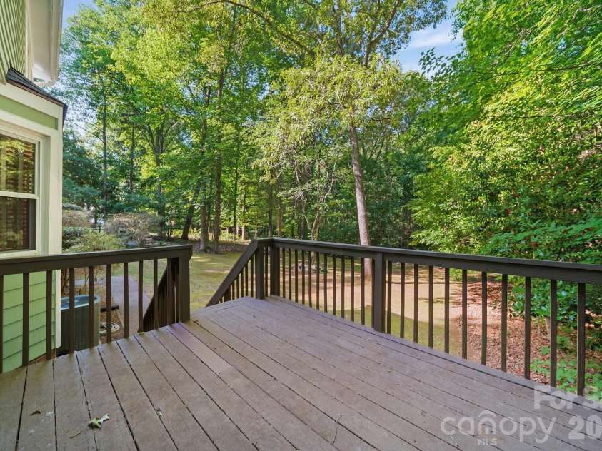 11421 Winners Circle, Charlotte, NC 28215.  MLS# CAR4344294, YatesRealty ID 23444. Deck off Living Room