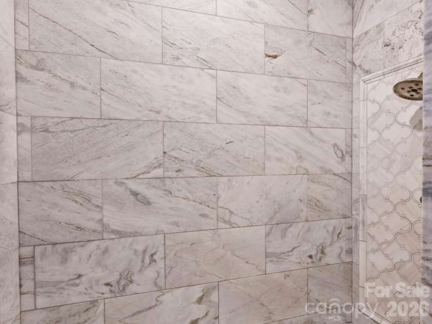 2313 Richardson Drive, Charlotte, NC 28211.  MLS# CAR4382670, YatesRealty ID 23450. Primary glass enclosed shower