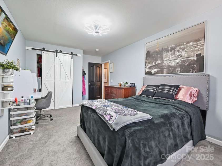 8140 Laurel Run Drive, Charlotte, NC 28269.  MLS# CAR4244296, YatesRealty ID 23451. Large Secondary Bedroom (1of 3)