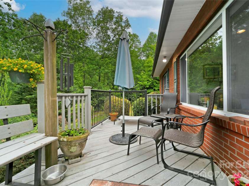 229 Hubbard Hollow Road, Rosman, NC 28772.  MLS# CAR4264936, YatesRealty ID 23454. Front deck / porch looks out to your trees and shrubs, flowers and side yard.