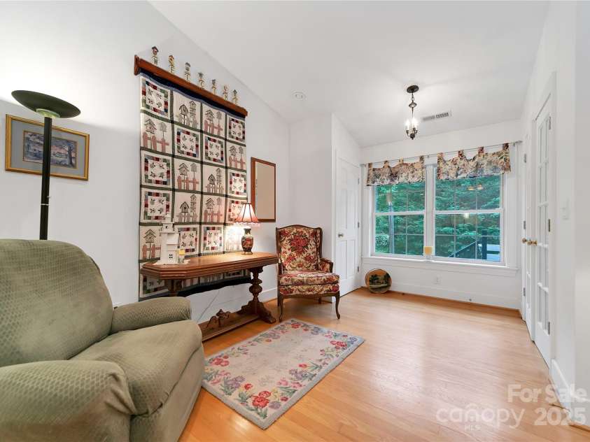 229 Hubbard Hollow Road, Rosman, NC 28772.  MLS# CAR4264936, YatesRealty ID 23454. The foyer / entry leads you from the sunroom to the living room with a beautiful wooden floor.