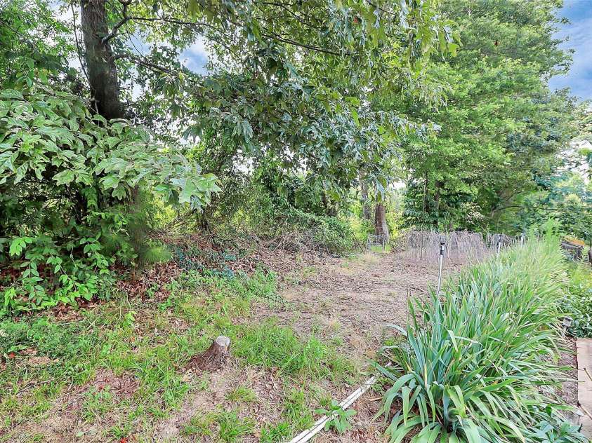 1288 Century Drive, Clover, SC 29710.  MLS# CAR4275472, YatesRealty ID 23456. Rear Yard garden area w/water