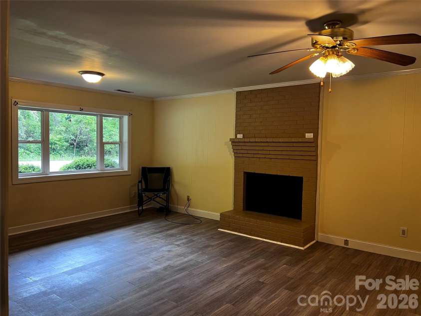 535 Nicholson Creek Road, Brevard, NC 28712.  MLS# CAR4362602, YatesRealty ID 23457. Woodburning fireplace