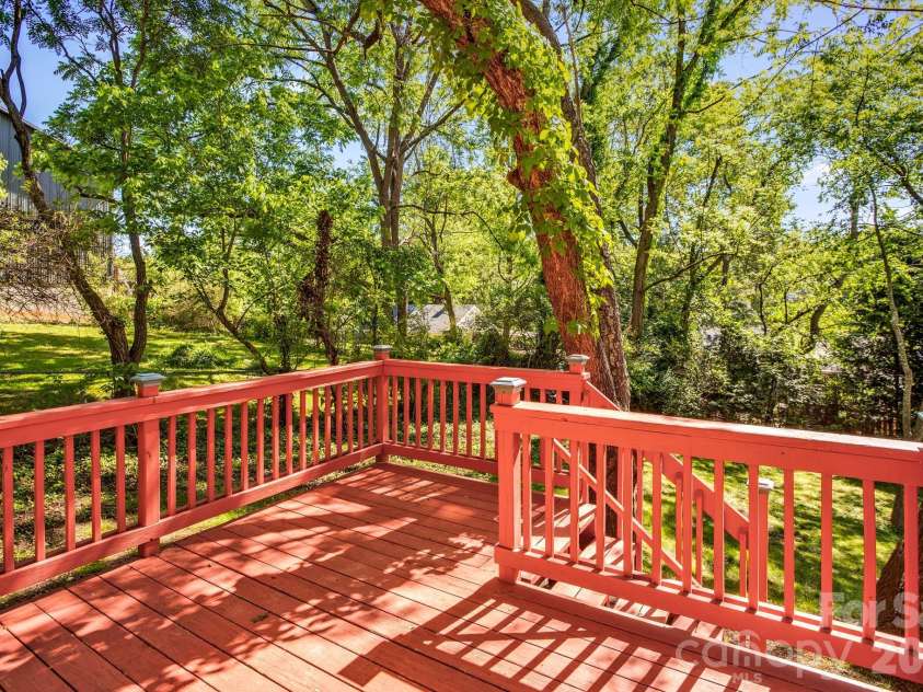32 Swannanoa Avenue, Asheville, NC 28806.  MLS# CAR4365833, YatesRealty ID 23460. Sunny deck off the apartment kitchen overlooking the backyard