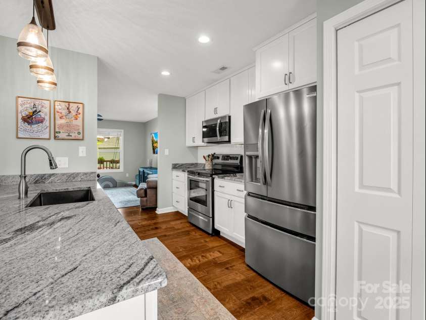 725 Center Street, Asheville, NC 28803.  MLS# CAR4262611, YatesRealty ID 23464. Kitchen to LR View