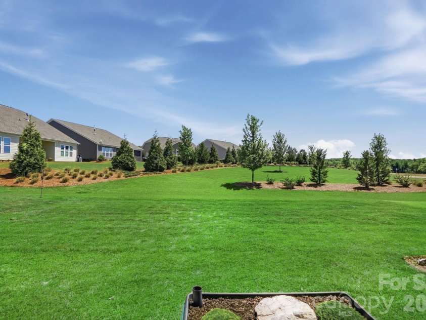 2015 Belle Mont Farm Avenue, Monroe, NC 28110.  MLS# CAR4369410, YatesRealty ID 23465. Bermuda grass is still growing in—photo enhanced to show its expected green, finished look.
