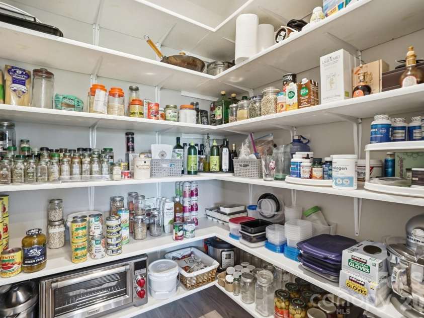 2015 Belle Mont Farm Avenue, Monroe, NC 28110.  MLS# CAR4369410, YatesRealty ID 23465. Custom pantry shelving 