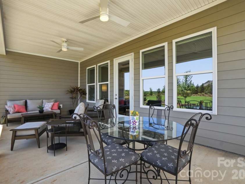 2015 Belle Mont Farm Avenue, Monroe, NC 28110.  MLS# CAR4369410, YatesRealty ID 23465. Enjoy eating outside under this large covered porch.
