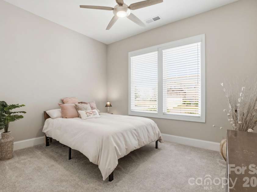 2015 Belle Mont Farm Avenue, Monroe, NC 28110.  MLS# CAR4369410, YatesRealty ID 23465. Generously sized bedroom with plenty of space for furniture and personalization.