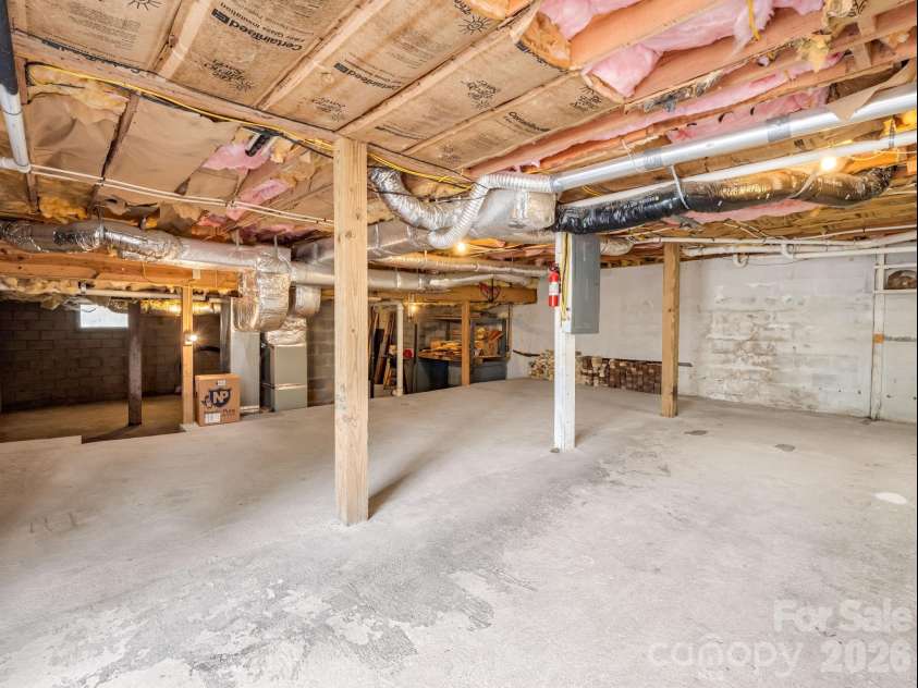 78 Wahuhu Court, Brevard, NC 28712.  MLS# CAR4369792, YatesRealty ID 23466. Large Storage Area of the Basement