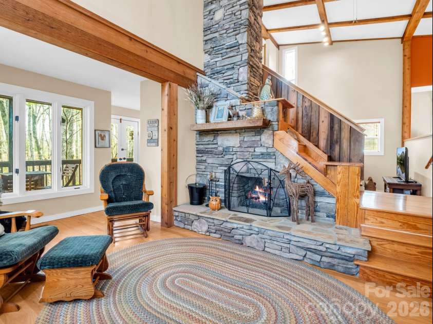 78 Wahuhu Court, Brevard, NC 28712.  MLS# CAR4369792, YatesRealty ID 23466. Living Room showing fireplace