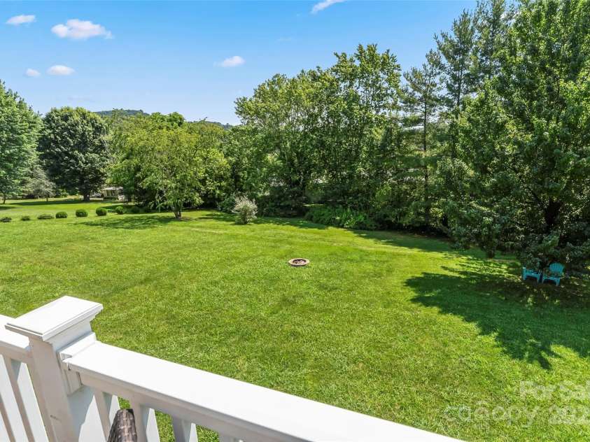 860 Asbury Road, Candler, NC 28715.  MLS# CAR4275726, YatesRealty ID 23471. Backyard