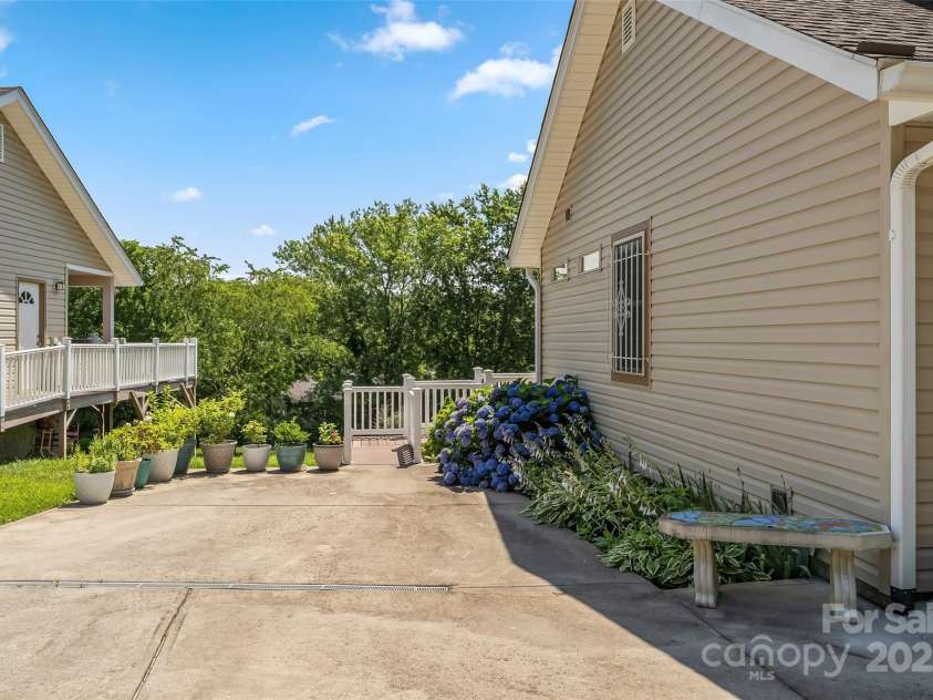 860 Asbury Road, Candler, NC 28715.  MLS# CAR4275726, YatesRealty ID 23471. Driveway area