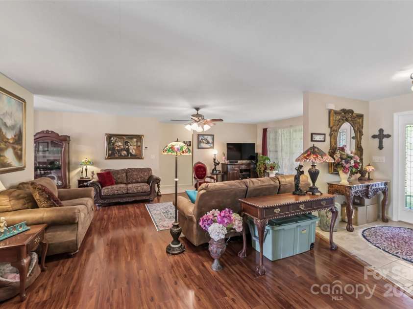 860 Asbury Road, Candler, NC 28715.  MLS# CAR4275726, YatesRealty ID 23471. Foyer into open living room