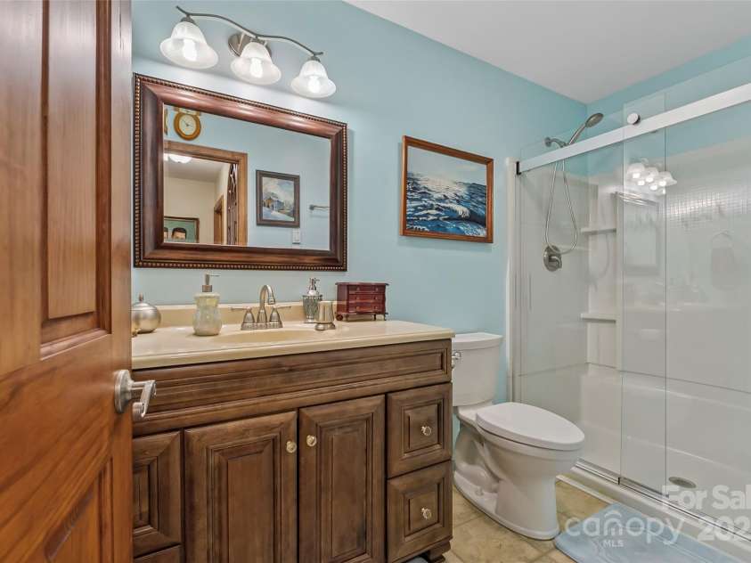 860 Asbury Road, Candler, NC 28715.  MLS# CAR4275726, YatesRealty ID 23471. Full Hall Bathroom