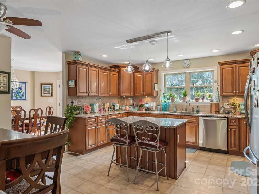860 Asbury Road, Candler, NC 28715.  MLS# CAR4275726, YatesRealty ID 23471. Kitchen into Dining Room