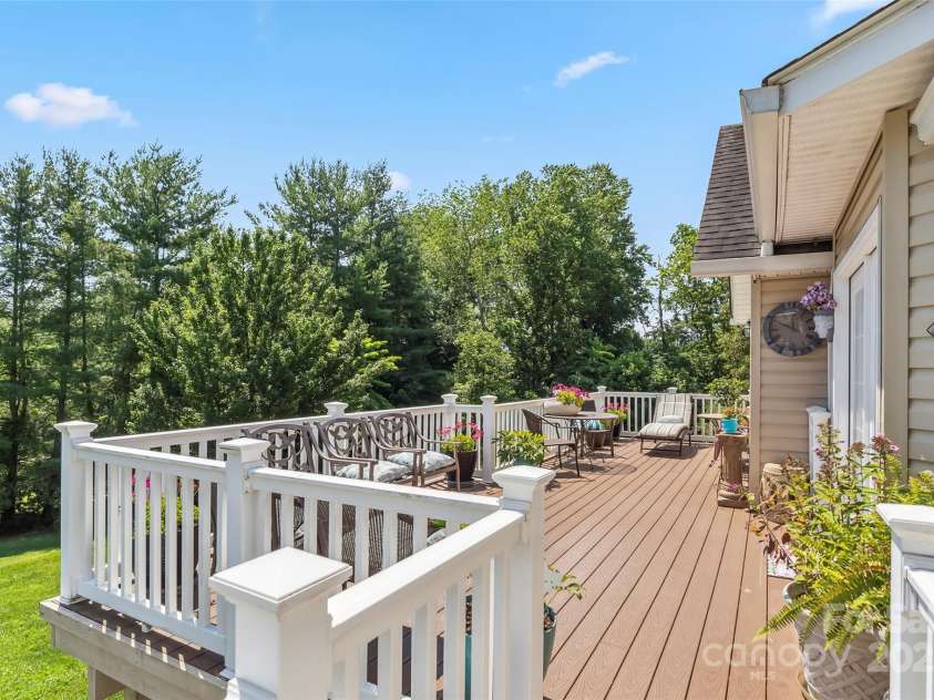 860 Asbury Road, Candler, NC 28715.  MLS# CAR4275726, YatesRealty ID 23471. Large Trex back deck with ramp to to the side of the house