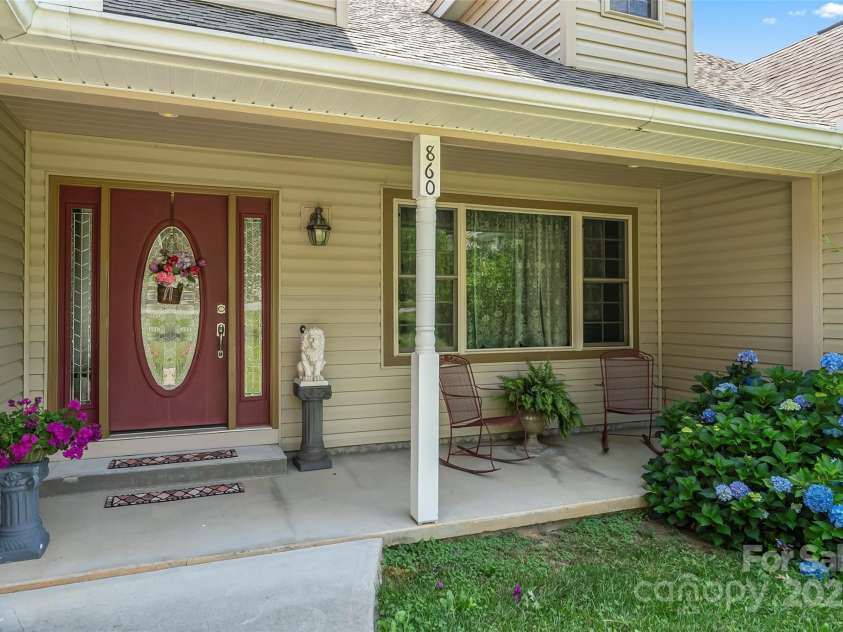 860 Asbury Road, Candler, NC 28715.  MLS# CAR4275726, YatesRealty ID 23471. Rocking Chair Front Porch