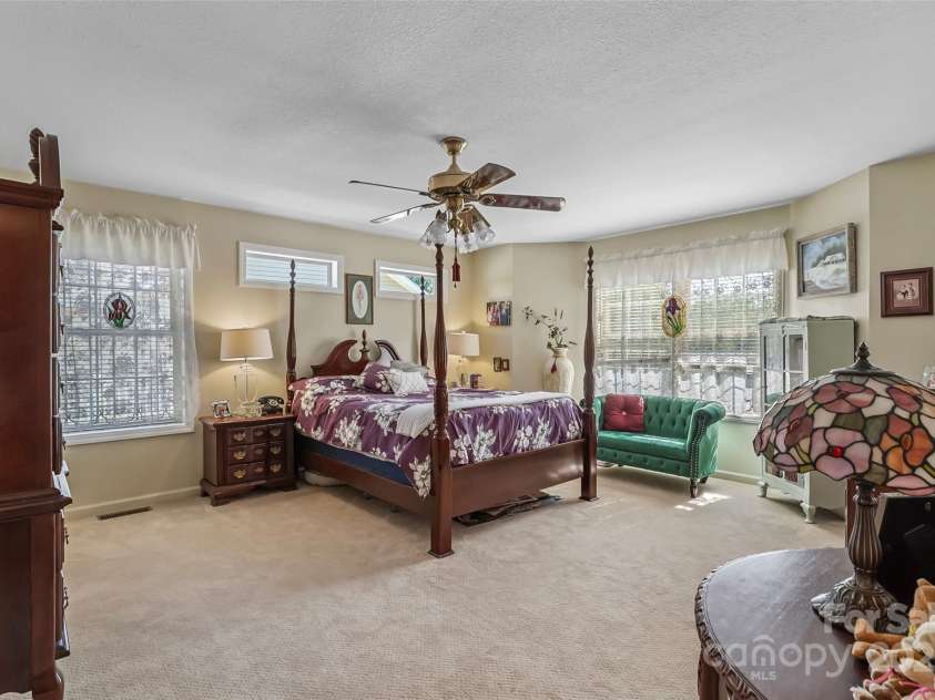 860 Asbury Road, Candler, NC 28715.  MLS# CAR4275726, YatesRealty ID 23471. Spacious Primary Suite with TWO walk-in closets