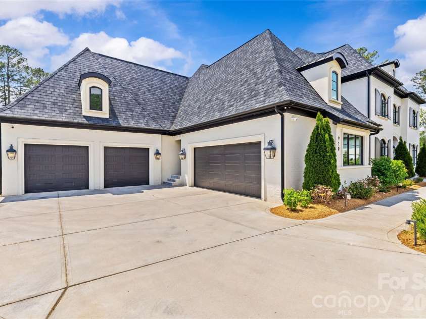 910 Deodar Cedar Drive, Weddington, NC 28104.  MLS# CAR4377454, YatesRealty ID 23475. 4 car garage