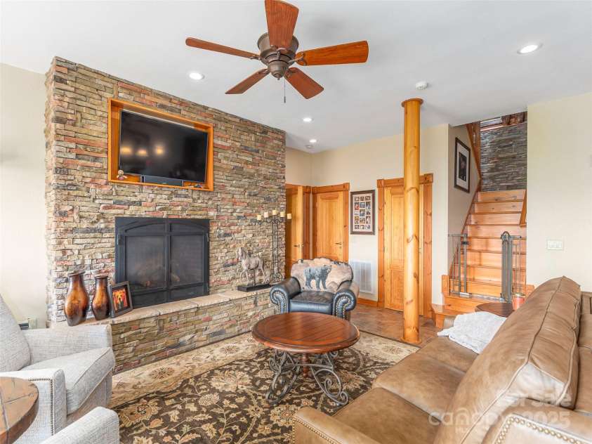 574 Leatherwood Drive, Maggie Valley, NC 28751.  MLS# CAR4275910, YatesRealty ID 23479. Gas fireplace in the lower den