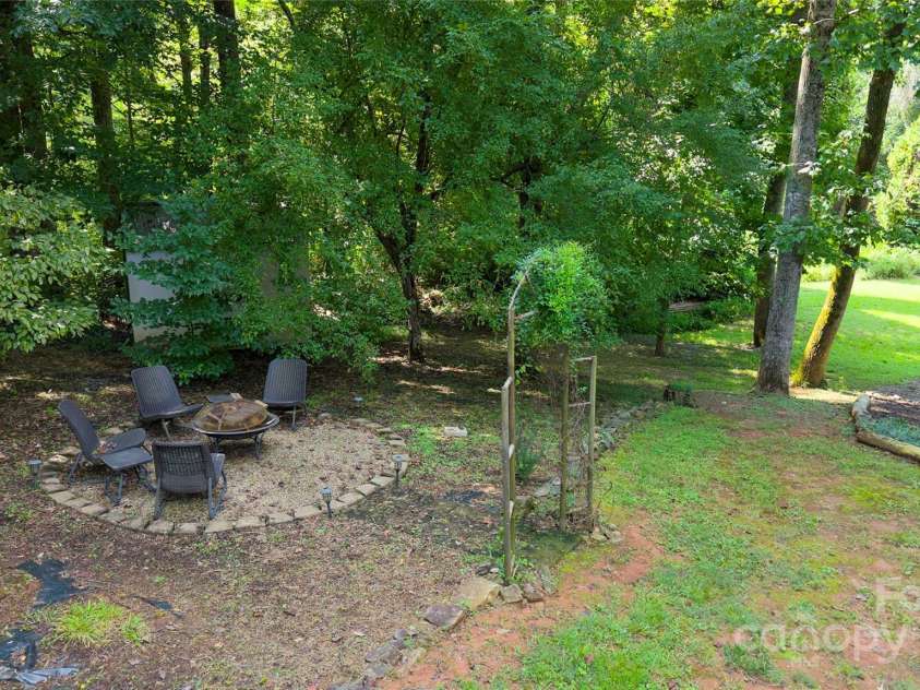147 Bridge Lane, Tryon, NC 28782.  MLS# CAR4293368, YatesRealty ID 2348. Firepit