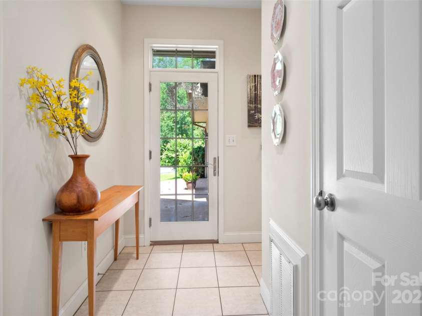 147 Bridge Lane, Tryon, NC 28782.  MLS# CAR4293368, YatesRealty ID 2348. Hall to garage