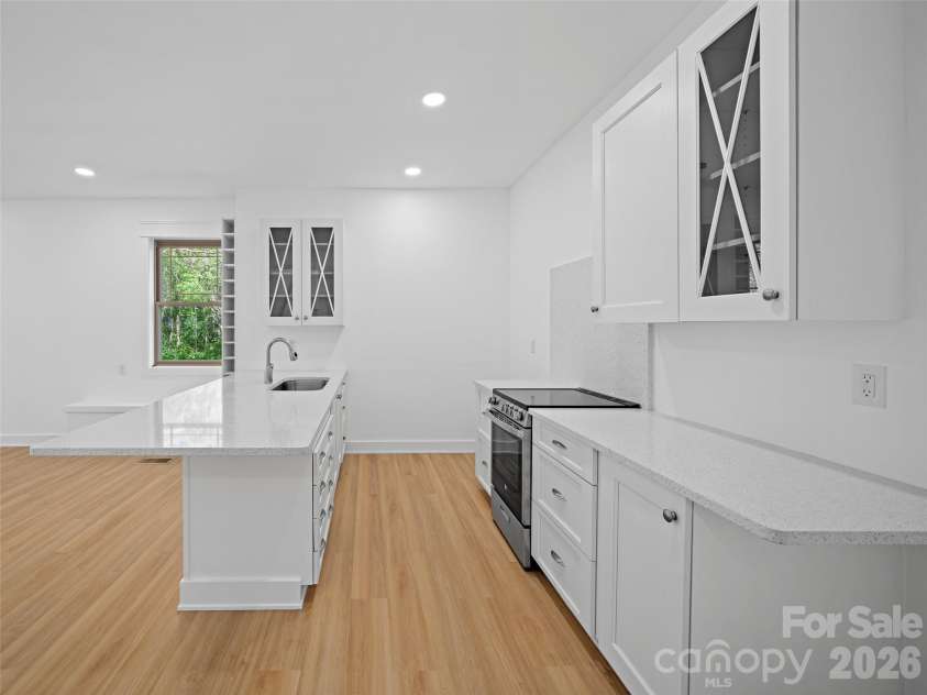 92 Cedar Street, Asheville, NC 28803.  MLS# CAR4377479, YatesRealty ID 23482. Finished basement kitchen.