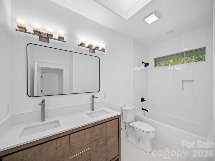 92 Cedar Street, Asheville, NC 28803.  MLS# CAR4377479, YatesRealty ID 23482. Main bedroom ensuite bath with double vanity