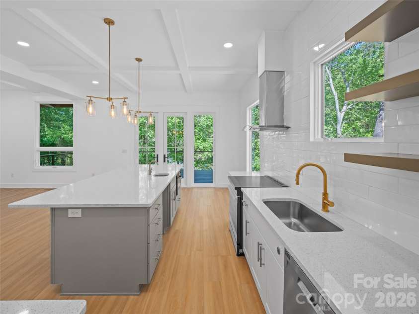 92 Cedar Street, Asheville, NC 28803.  MLS# CAR4377479, YatesRealty ID 23482. Main level kitchen and great room with doors to back deck