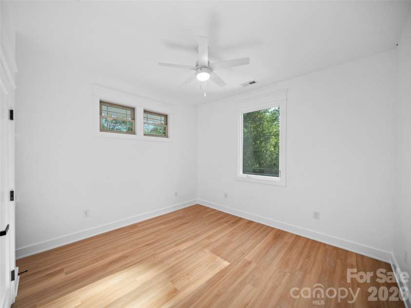 92 Cedar Street, Asheville, NC 28803.  MLS# CAR4377479, YatesRealty ID 23482. Upper level guest bedroom