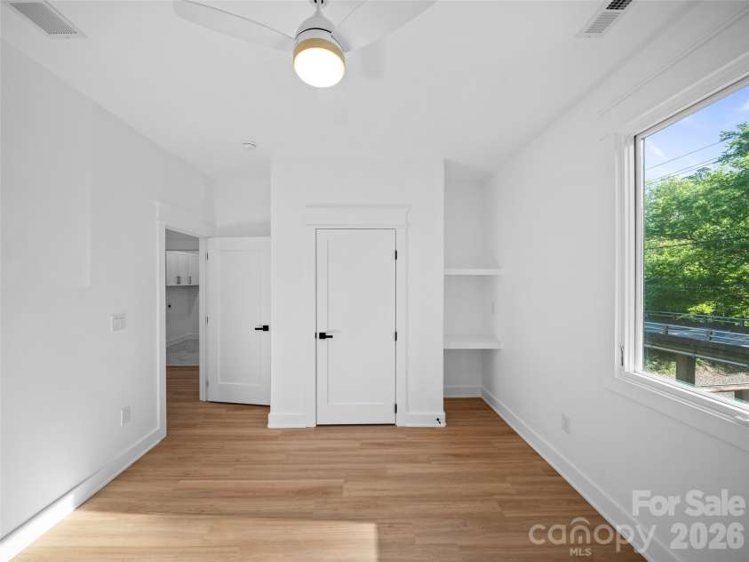 92 Cedar Street, Asheville, NC 28803.  MLS# CAR4377479, YatesRealty ID 23482. Upper level guest bedroom