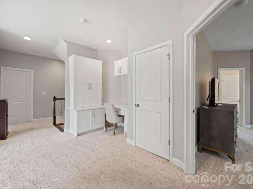 3022 Manchester Court, Indian Land, SC 29707.  MLS# CAR4358002, YatesRealty ID 23489. Second Floor Hallway with built in desk/office space/ storage