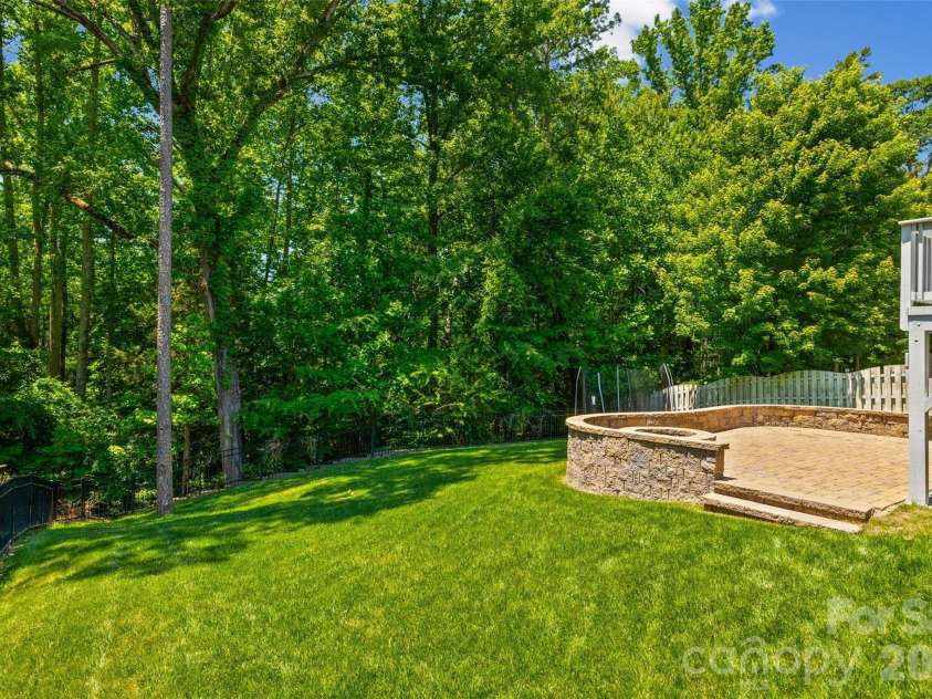 3022 Manchester Court, Indian Land, SC 29707.  MLS# CAR4358002, YatesRealty ID 23489. Spacious backyard with amazing view, and a patio with firepit.