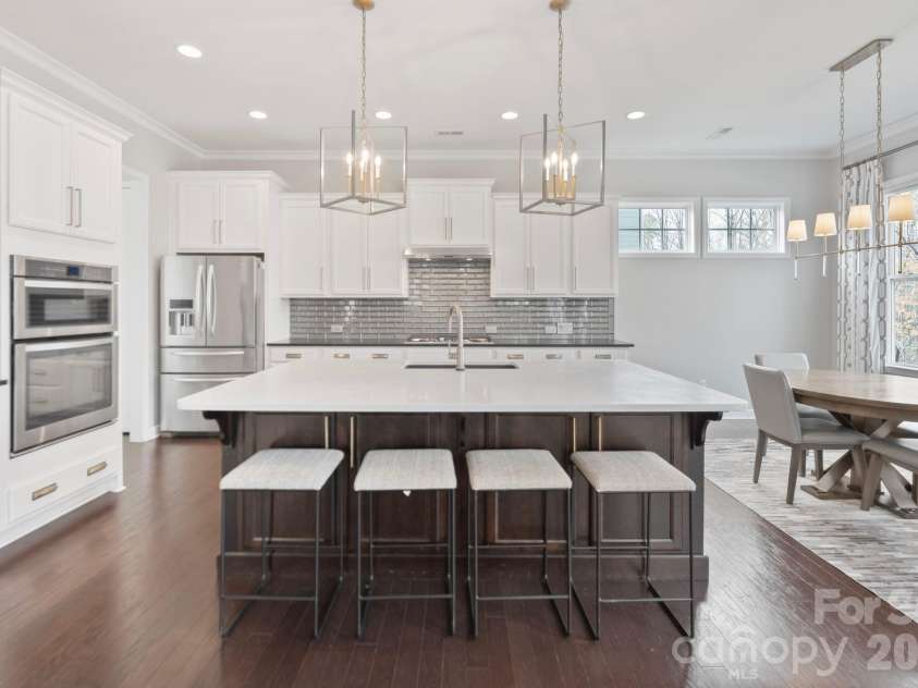 3022 Manchester Court, Indian Land, SC 29707.  MLS# CAR4358002, YatesRealty ID 23489. Stunning high end kitchen with leathers countertop on the permiter, and a stunning white quartz island 