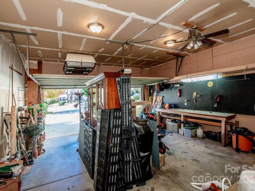 2344 Smith Cove Road, Denver, NC 28037.  MLS# CAR4321510, YatesRealty ID 2349. 2 car garage with workspace/table