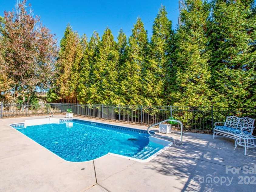2344 Smith Cove Road, Denver, NC 28037.  MLS# CAR4321510, YatesRealty ID 2349. Mature landscaping surrounds the pool for privacy