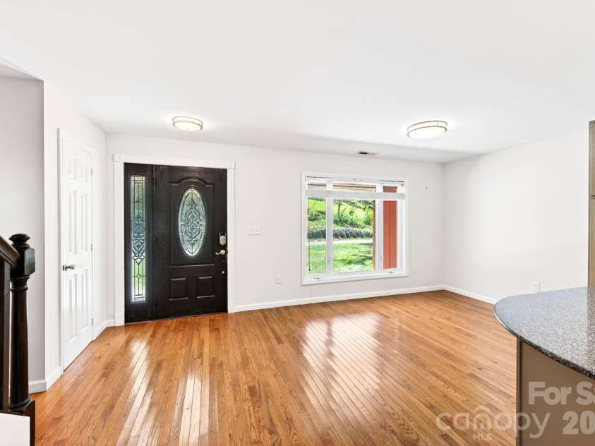 58 Camby Drive, Fairview, NC 28730.  MLS# CAR4371628, YatesRealty ID 23505. Apartment Front Door and Dining Area