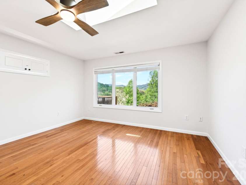 58 Camby Drive, Fairview, NC 28730.  MLS# CAR4371628, YatesRealty ID 23505. Apartment Lower Bedroom