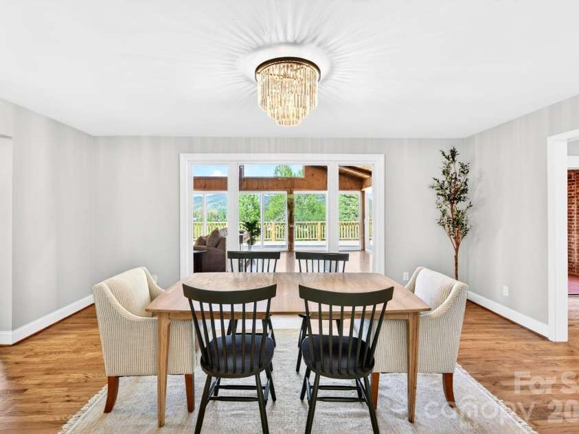 58 Camby Drive, Fairview, NC 28730.  MLS# CAR4371628, YatesRealty ID 23505. Beautiful Diningroom looking through the Sunroom