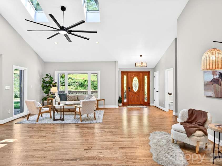 58 Camby Drive, Fairview, NC 28730.  MLS# CAR4371628, YatesRealty ID 23505. Front Door and Seating Area