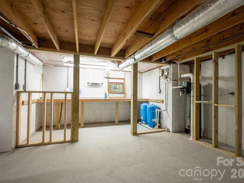 58 Camby Drive, Fairview, NC 28730.  MLS# CAR4371628, YatesRealty ID 23505. Huge basement with Workshop Options