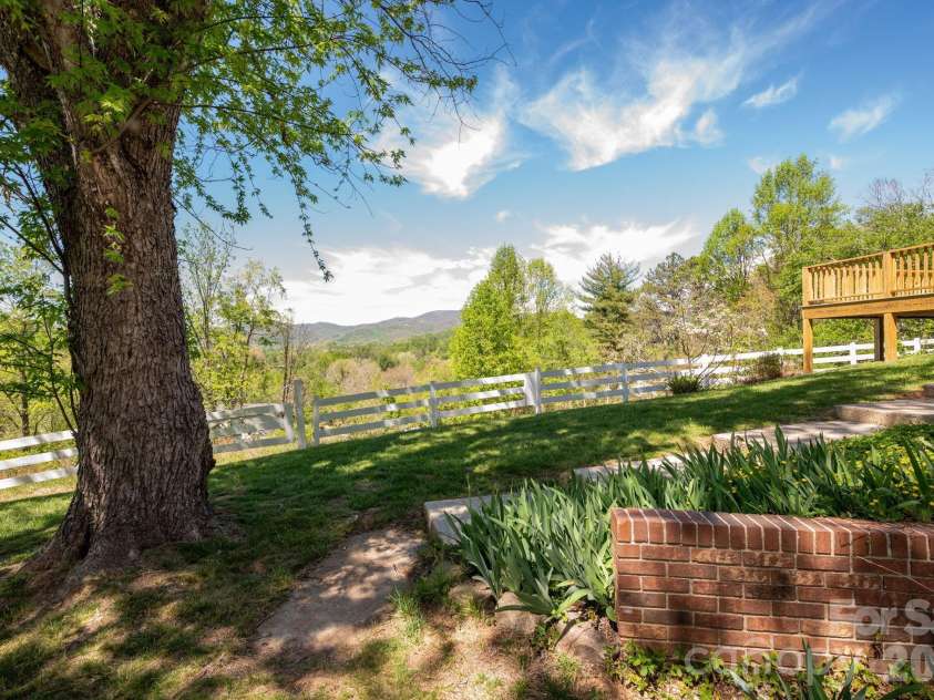 58 Camby Drive, Fairview, NC 28730.  MLS# CAR4371628, YatesRealty ID 23505. Summertime Shade Tree