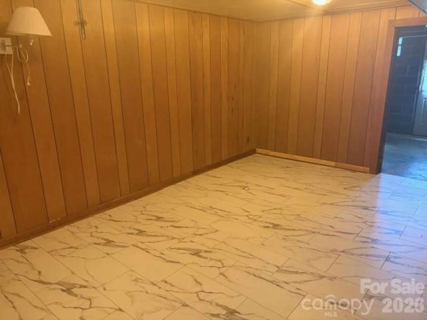 242 Edgewood Circle, Morganton, NC 28655.  MLS# CAR4381653, YatesRealty ID 23506. Lower level craft room with nice flooring