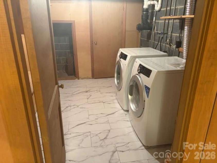 242 Edgewood Circle, Morganton, NC 28655.  MLS# CAR4381653, YatesRealty ID 23506. Lower level laundry room