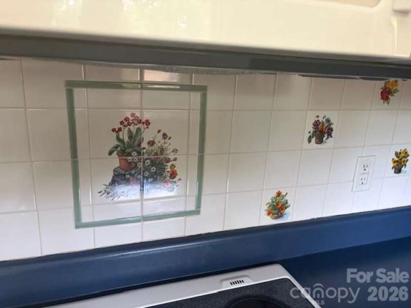 242 Edgewood Circle, Morganton, NC 28655.  MLS# CAR4381653, YatesRealty ID 23506. Pretty tiled back splash