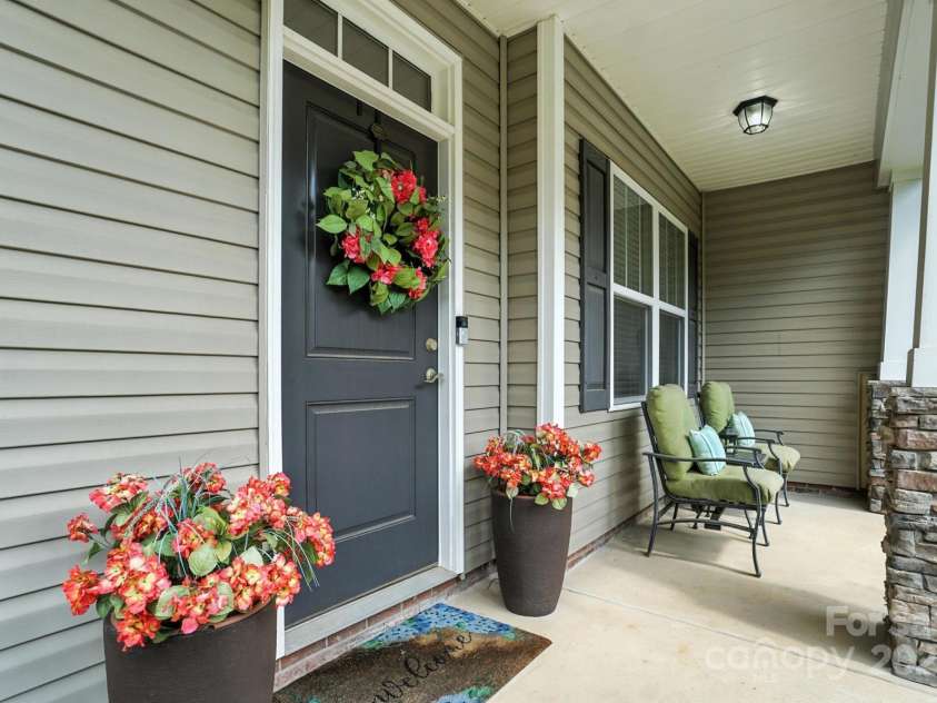 8275 Normandy Road, Denver, NC 28037.  MLS# CAR4276135, YatesRealty ID 23508. Rocking chair front porch.